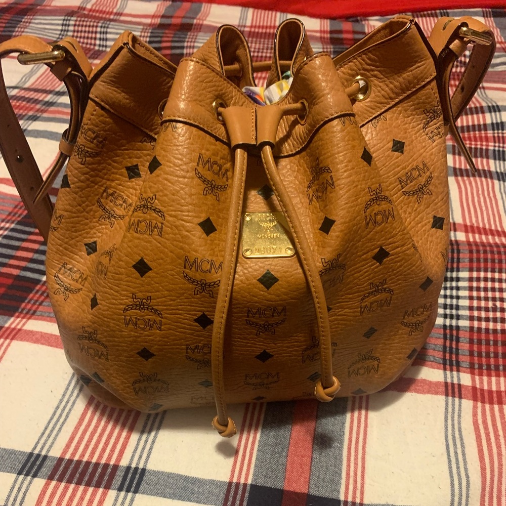 The heritage bucket bag, crafted in monogram coated canvas with French leather.